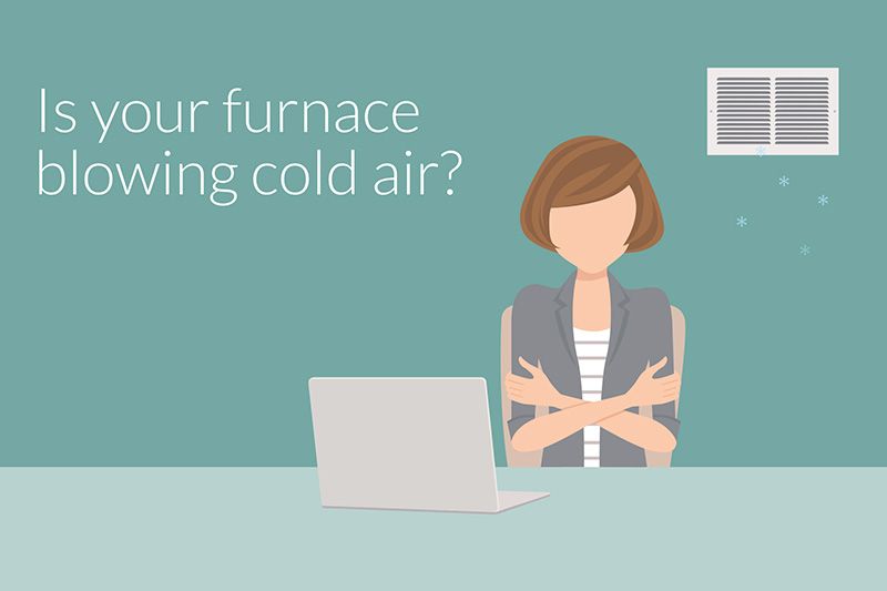 A woman in front of a laptop looks chilly. Why Is My Furnace Blowing Cold Air?